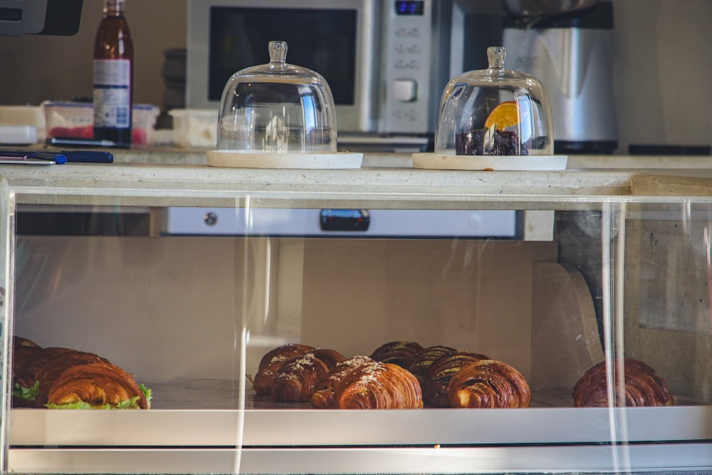 a display case filled with lots of pastries