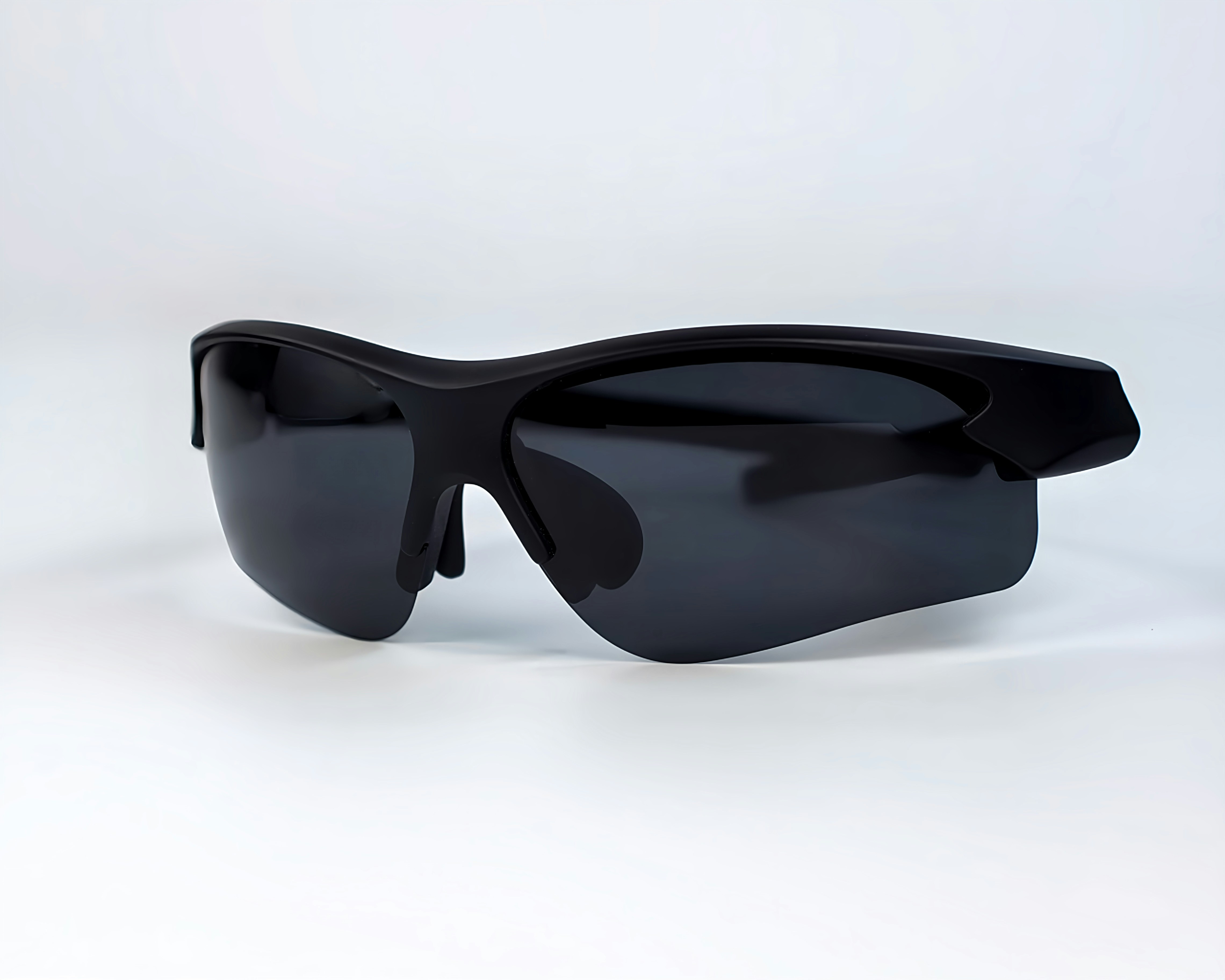 a pair of black sunglasses on a white background