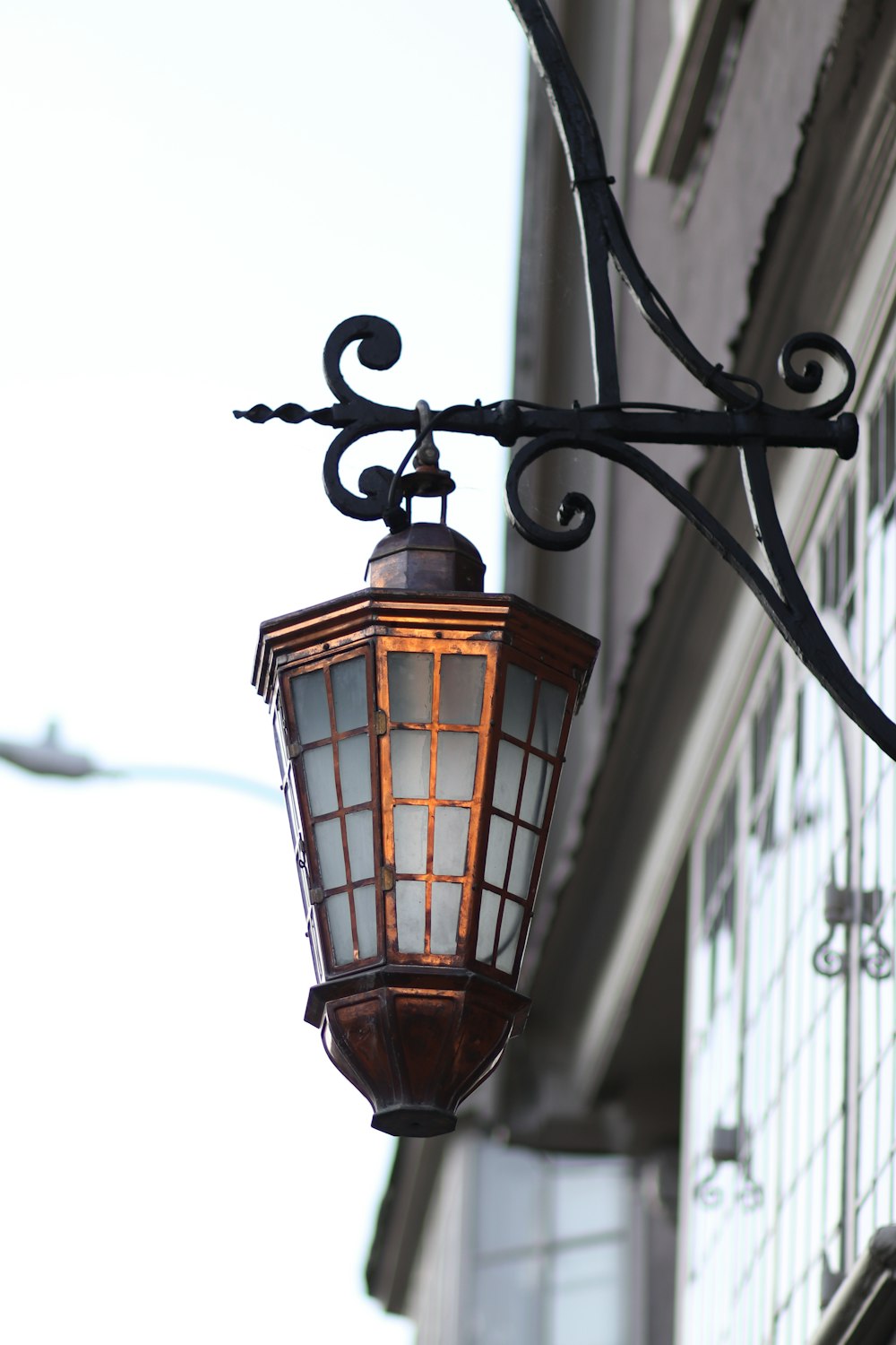 a street light hanging from the side of a building