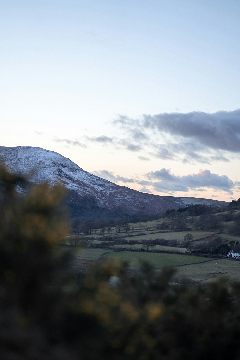 a view of a snow covered mountain from a distance