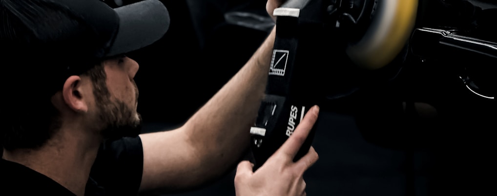 a man is working on a car radio