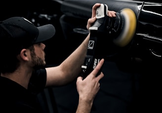 a man is working on a car radio