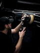 a man is working on a car radio