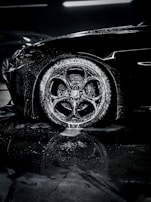 a close up of a car tire on a wet surface