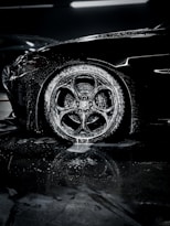 a close up of a car tire on a wet surface