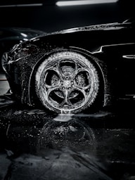 a close up of a car tire on a wet surface