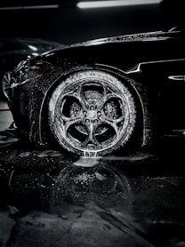 a close up of a car tire on a wet surface