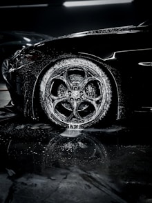 a close up of a car tire on a wet surface