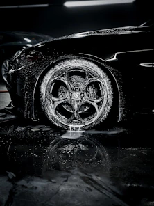 a close up of a car tire on a wet surface