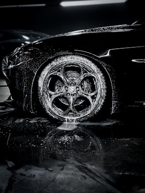 a close up of a car tire on a wet surface