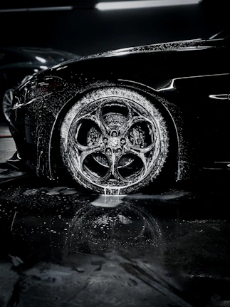a close up of a car tire on a wet surface