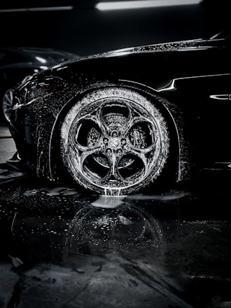 a close up of a car tire on a wet surface