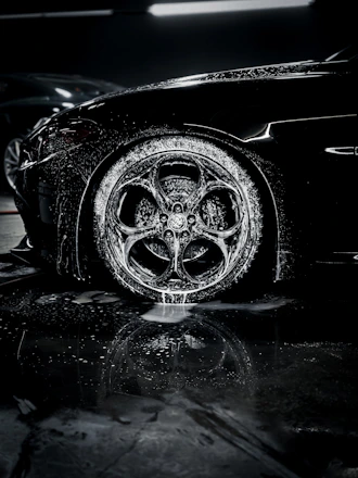 a close up of a car tire on a wet surface