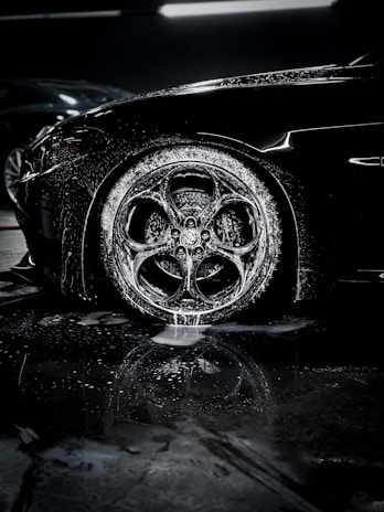 a close up of a car tire on a wet surface