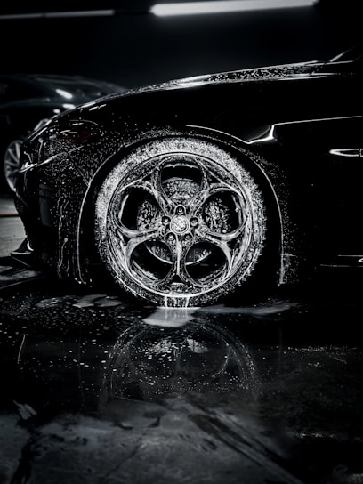 a close up of a car tire on a wet surface