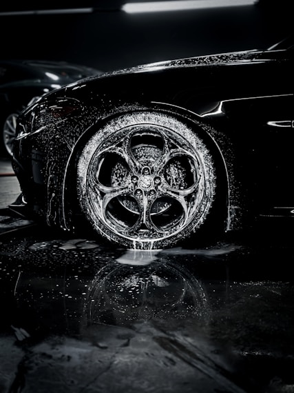 a close up of a car tire on a wet surface