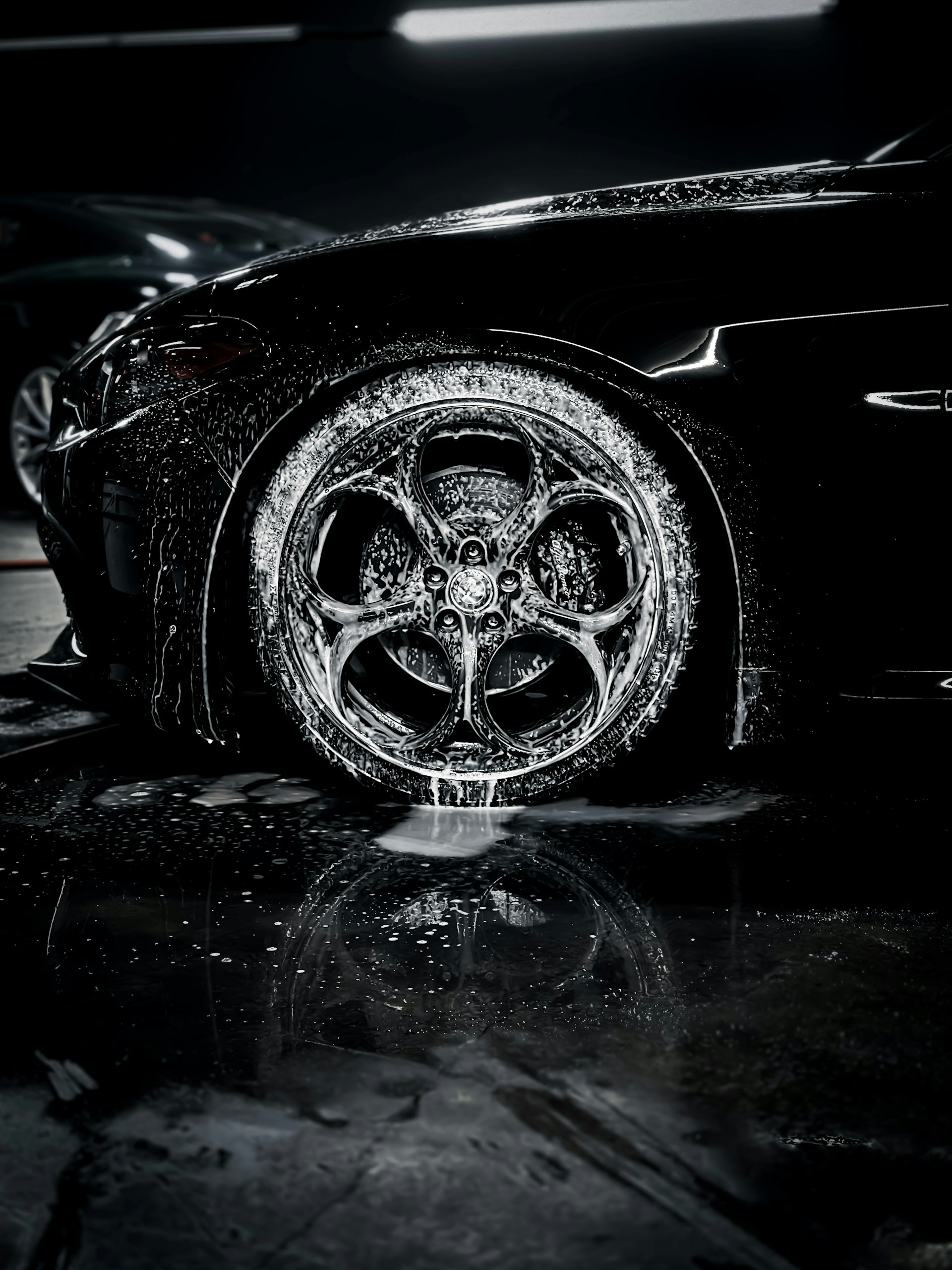 a close up of a car tire on a wet surface