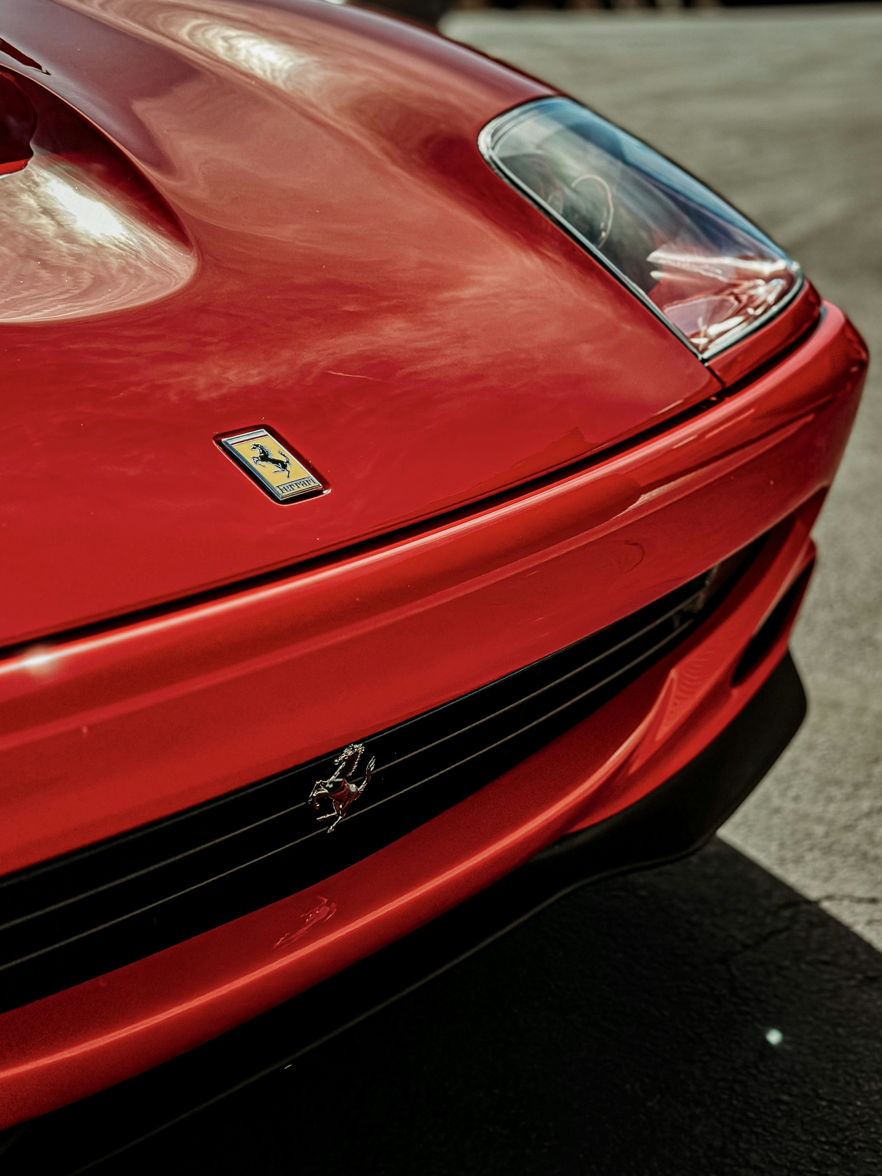 a red sports car parked in a parking lot