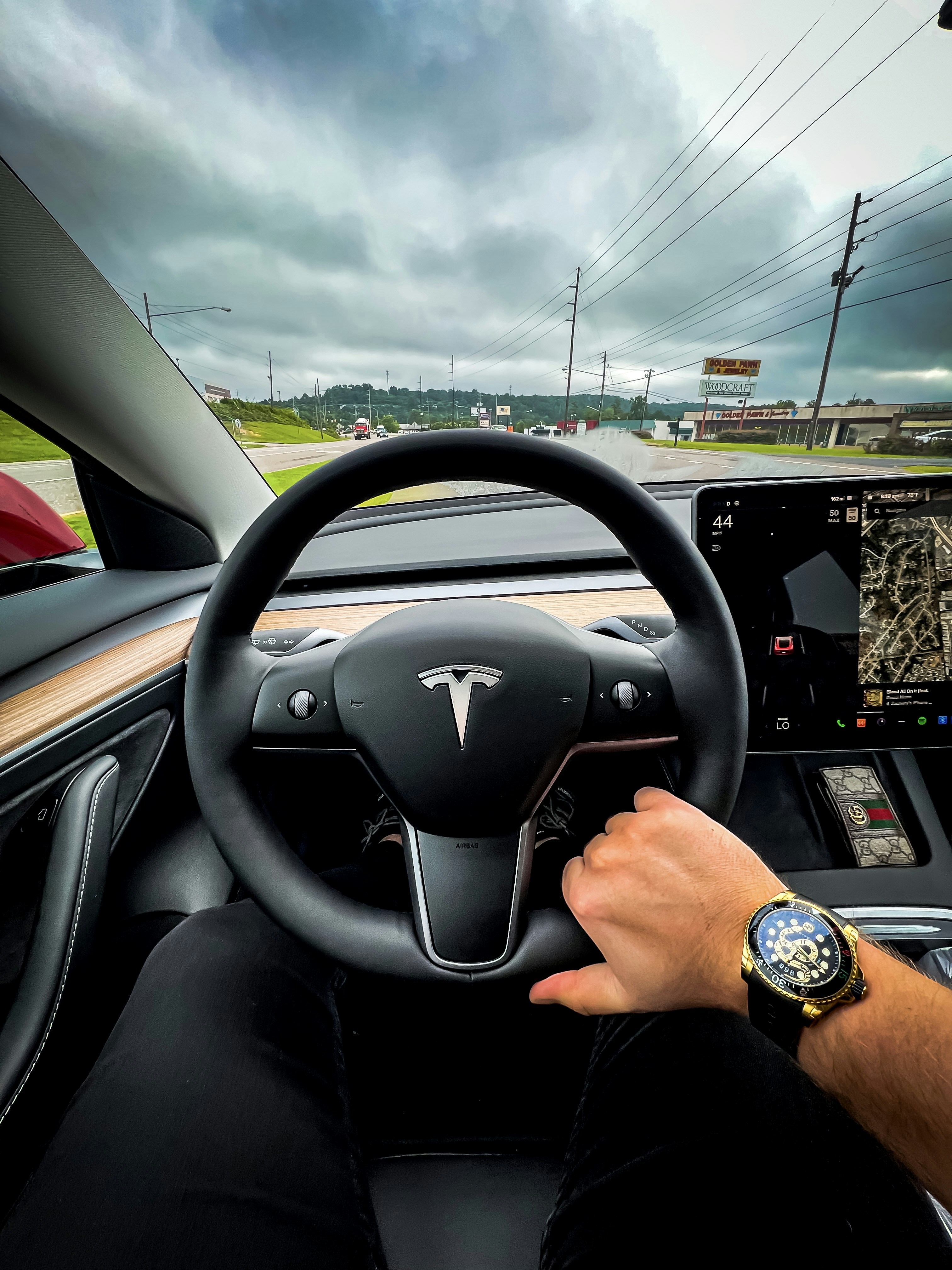 a man driving a car on a highway