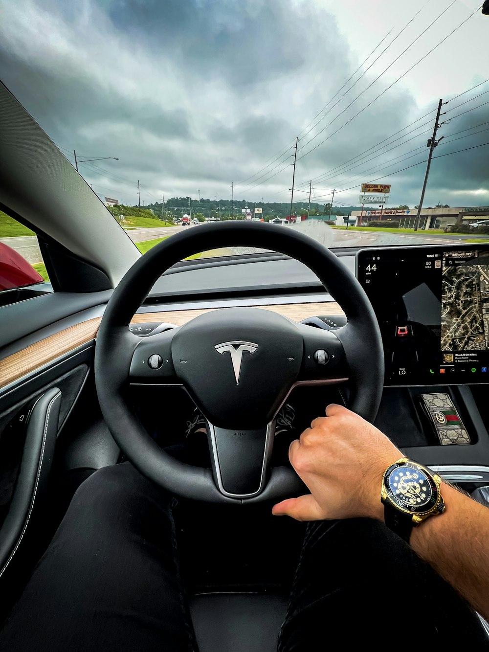 a man driving a car on a highway