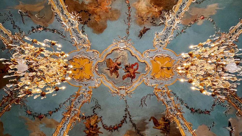 the ceiling of a building with a painting on it