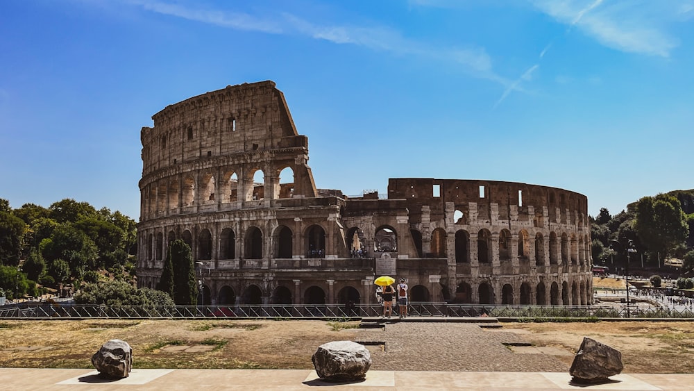 a man standing in front of an ancient building