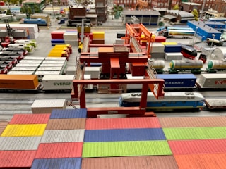 a model train yard with a lot of toy trains