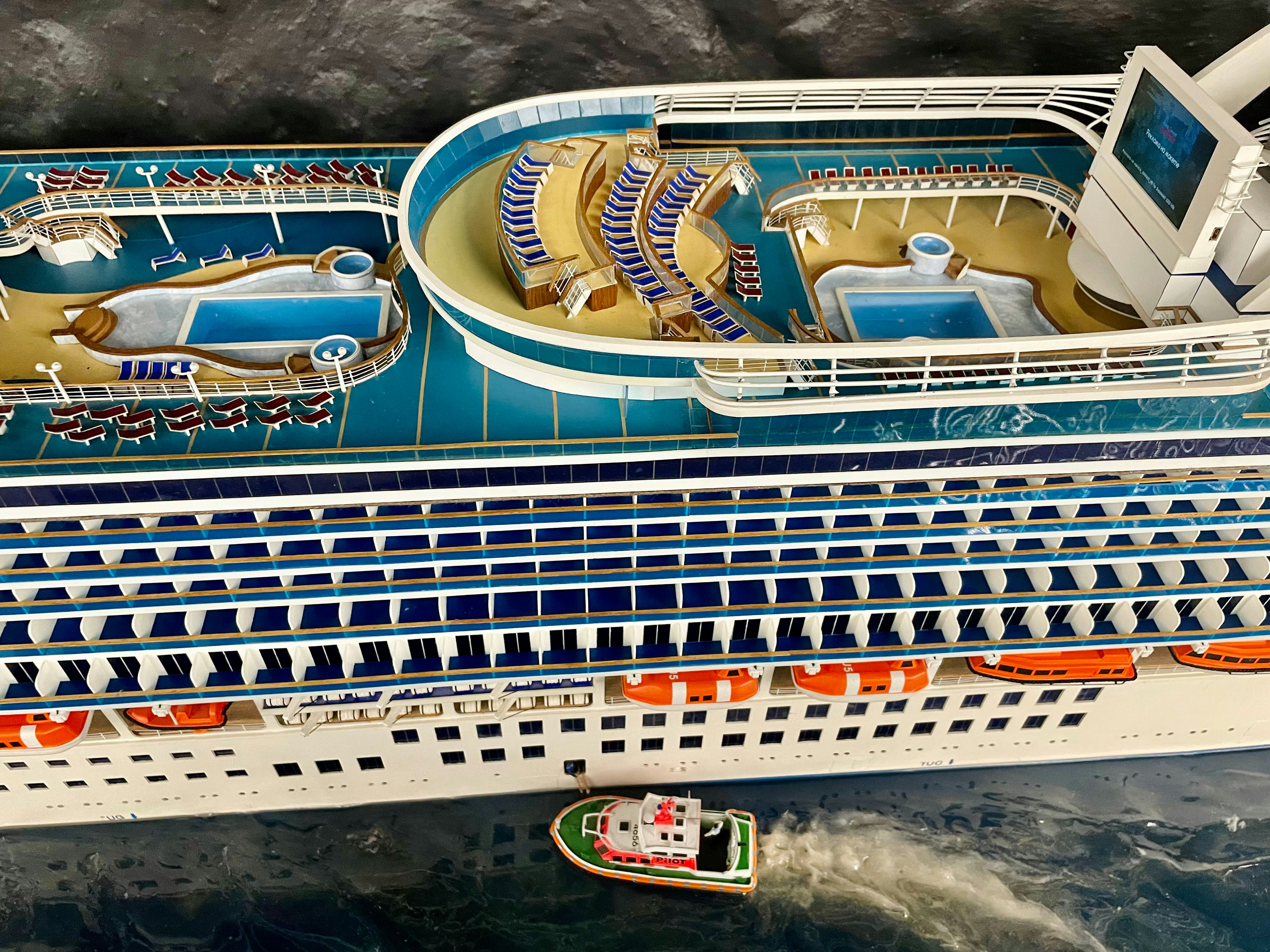 a model of a cruise ship in the water, 