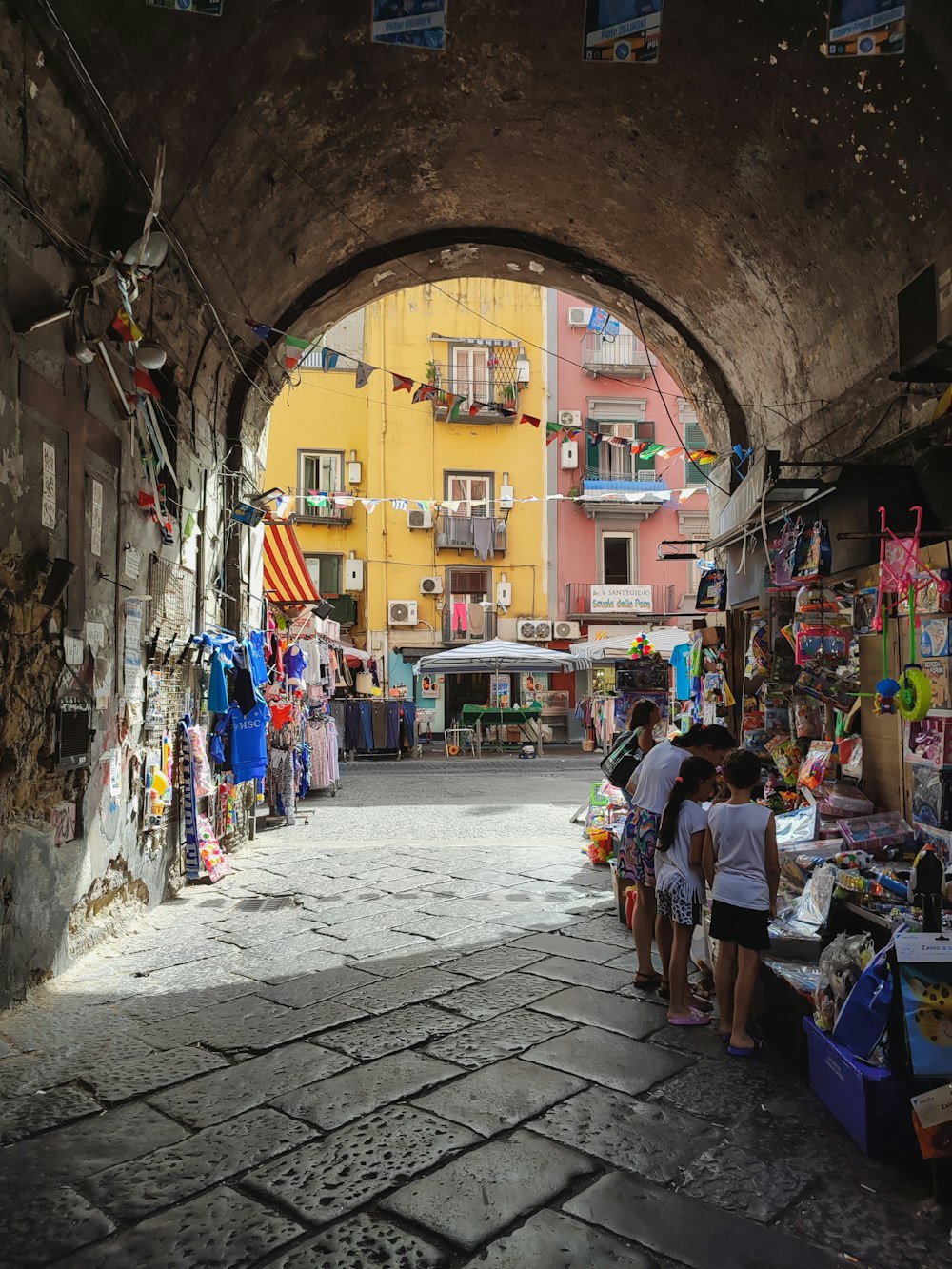 a group of people standing under an archway