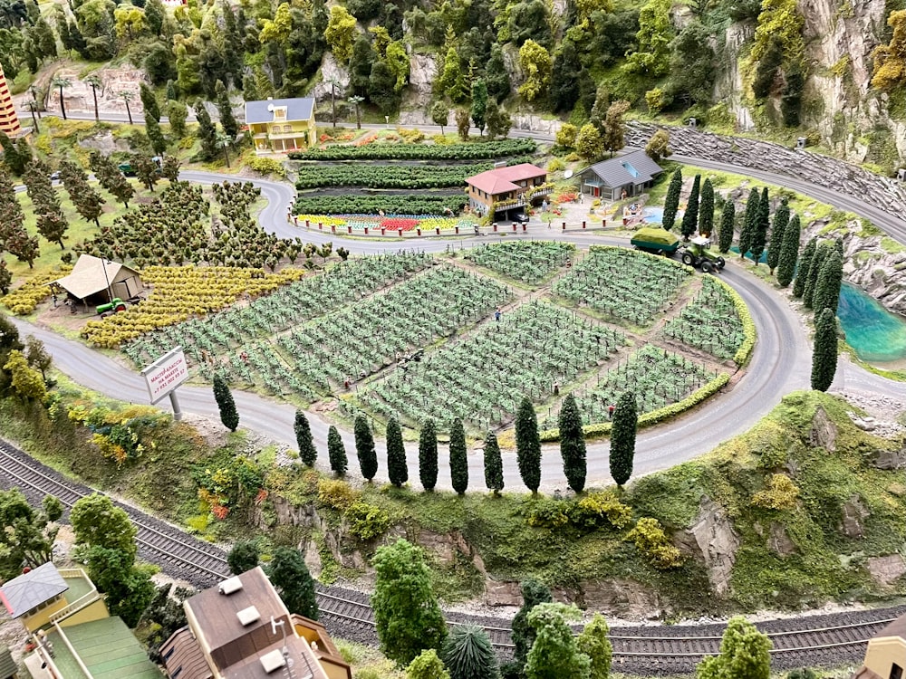 a model of a garden with a train track