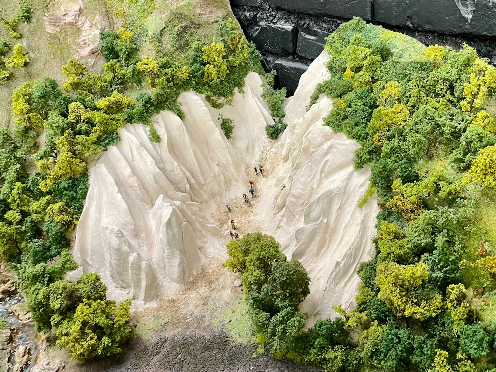a model of a mountain with people walking on it