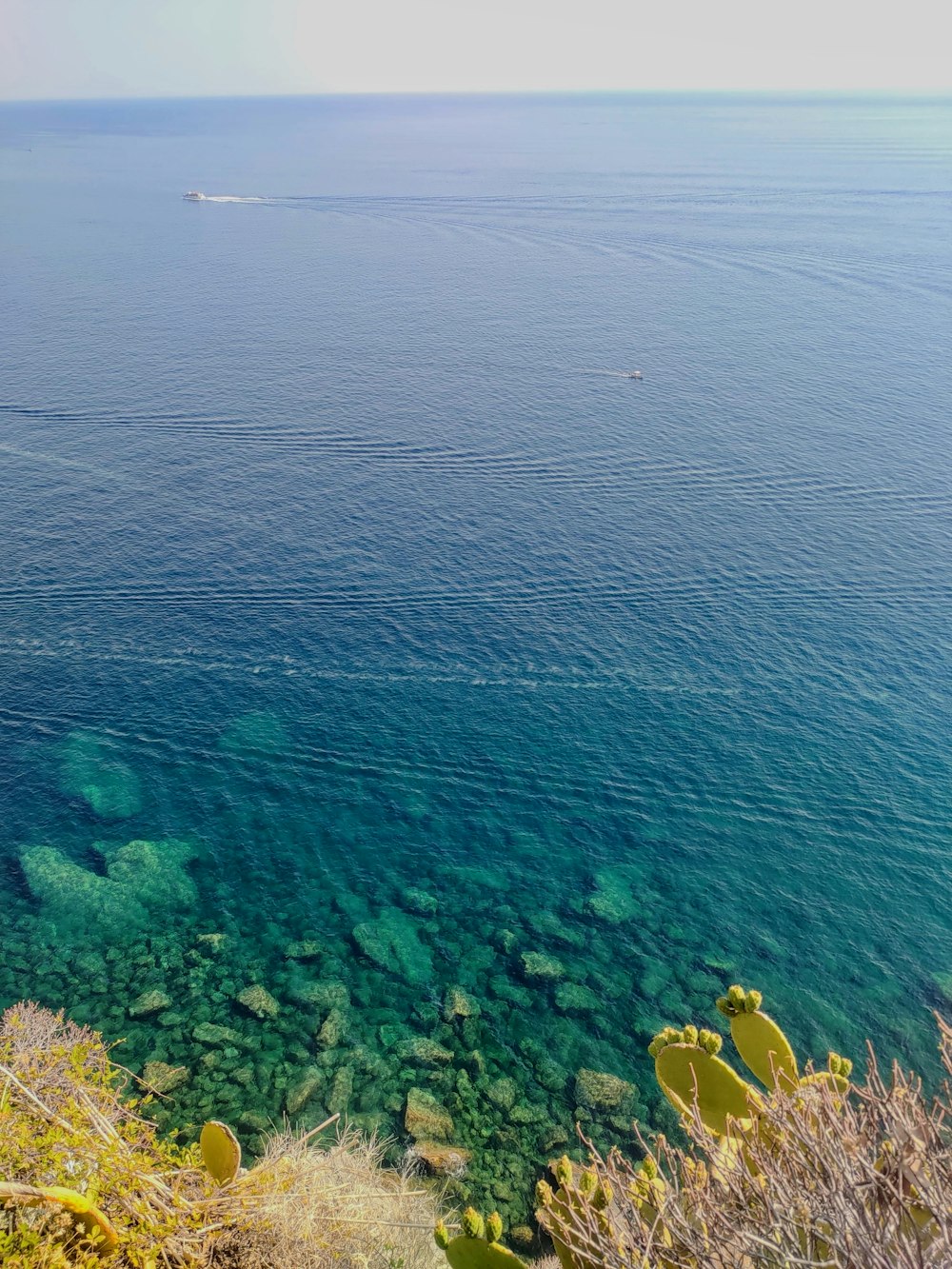 a body of water with a boat in the distance