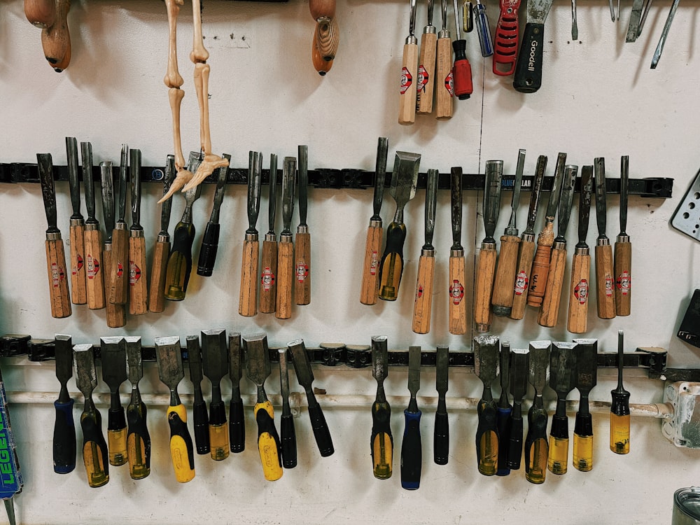 a bunch of tools hanging on a wall