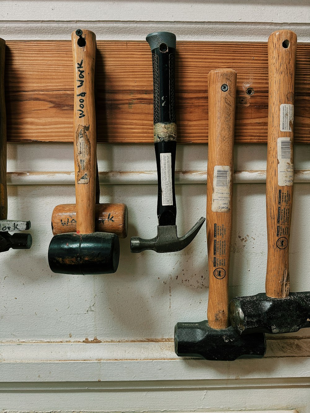 a bunch of tools hanging on a wall