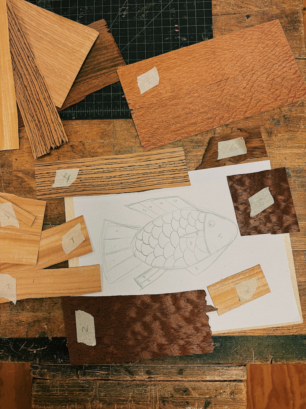 a wooden table topped with lots of different types of wood