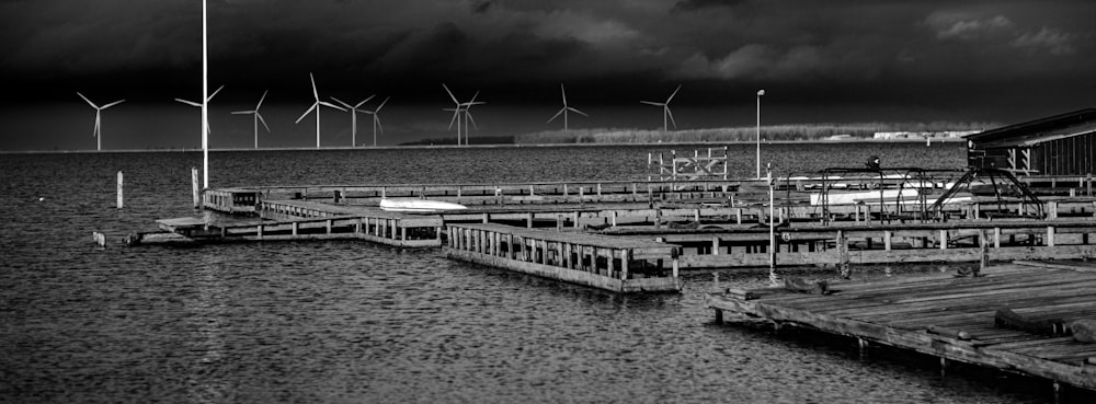 a black and white photo of a boat dock