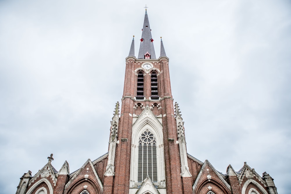 a tall church with a clock on it's side