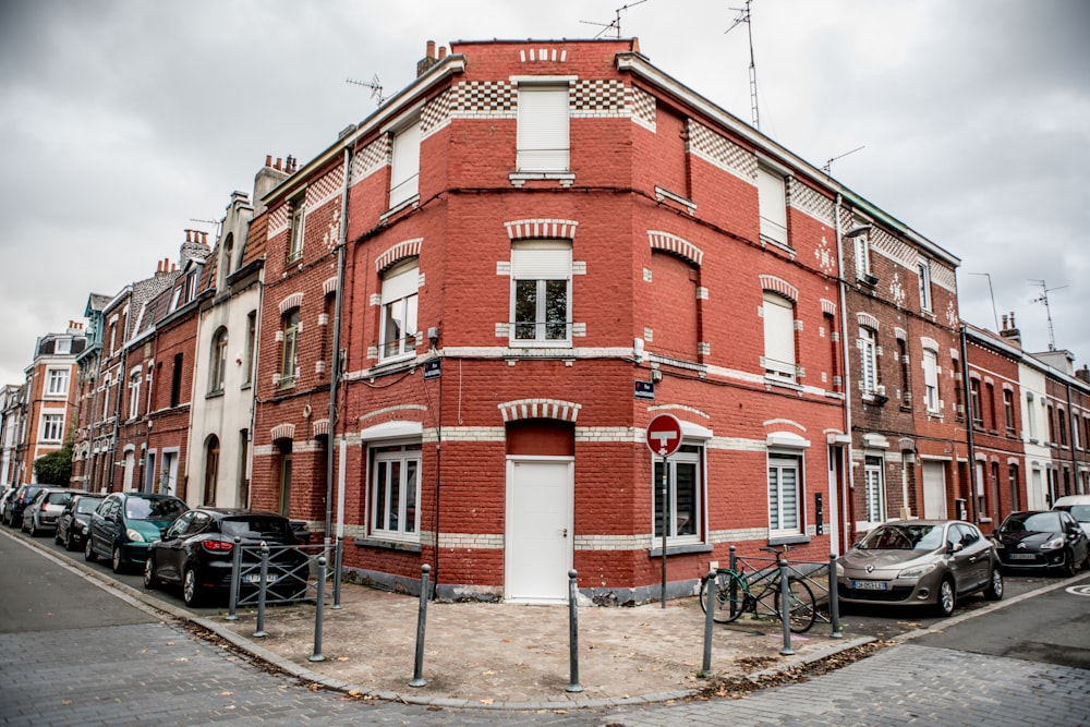 a red brick building with a bicycle parked in front of it