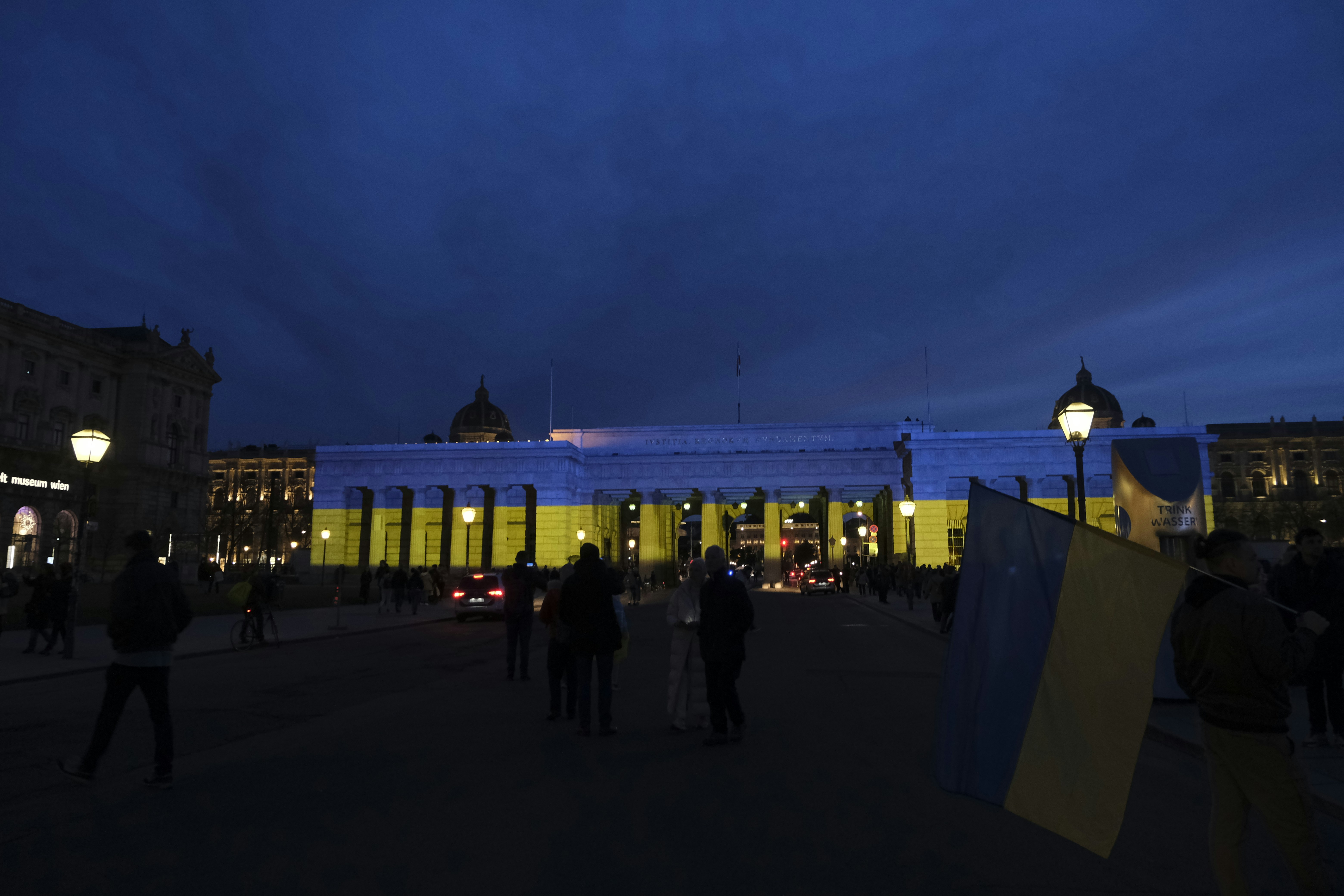 a group of people standing in front of a building