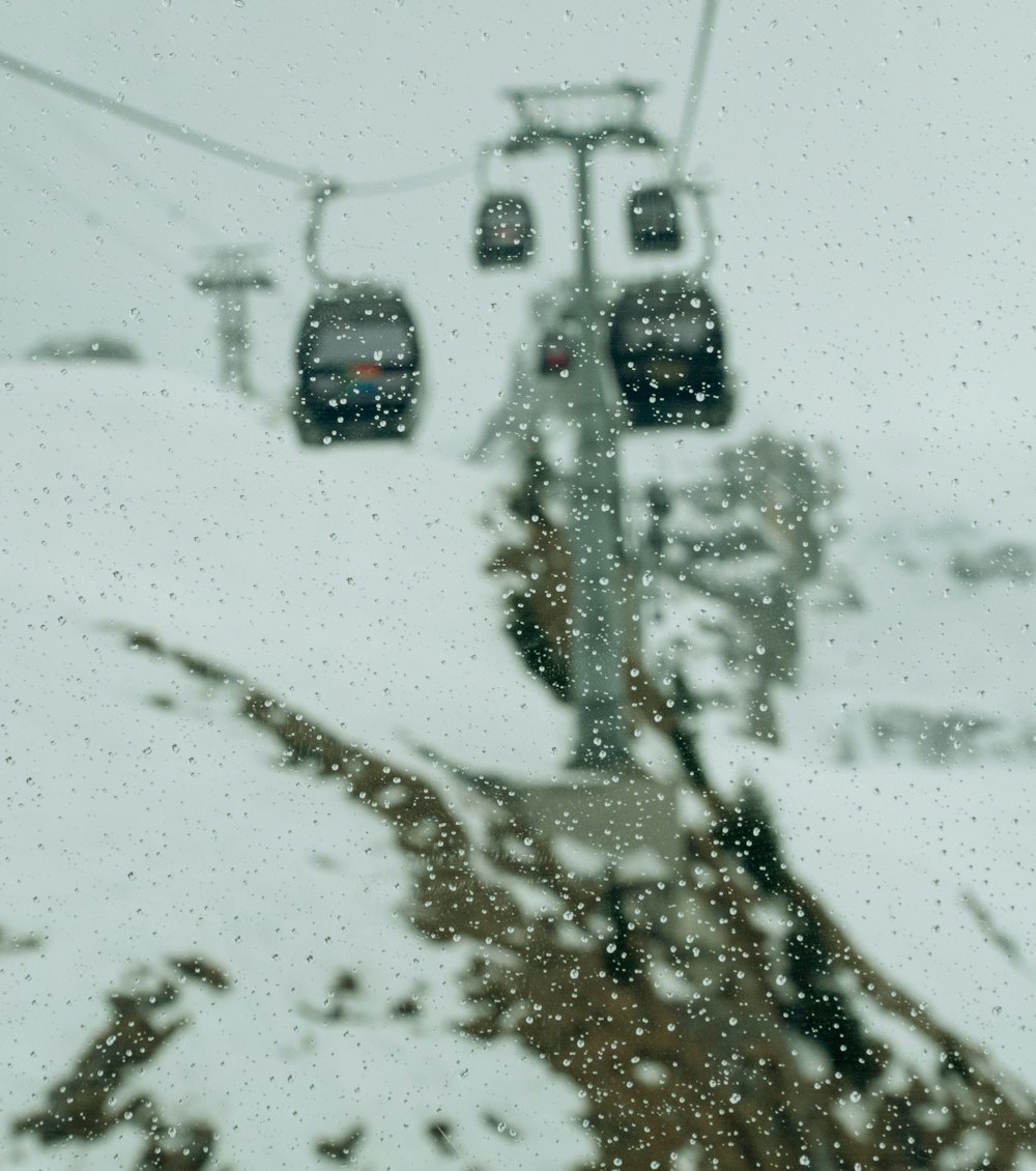 a view of a ski lift in the snow