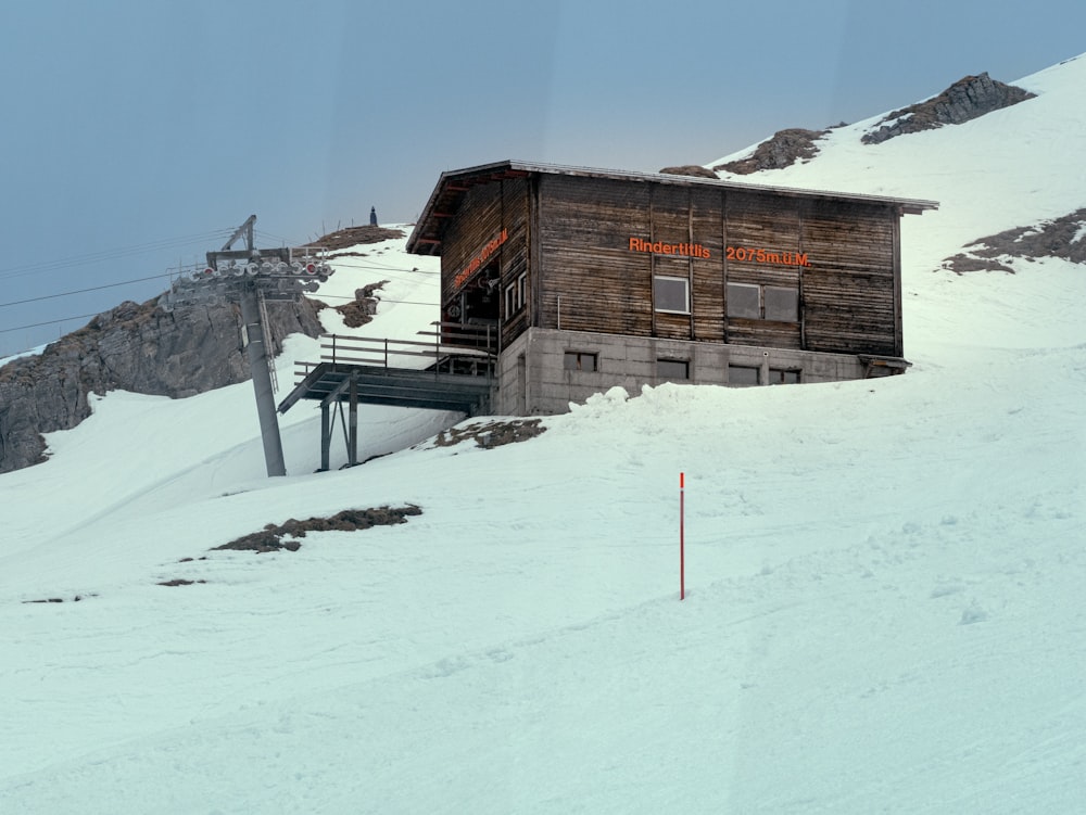 a ski lift going up a snowy mountain