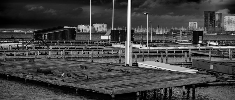 a black and white photo of a boat dock