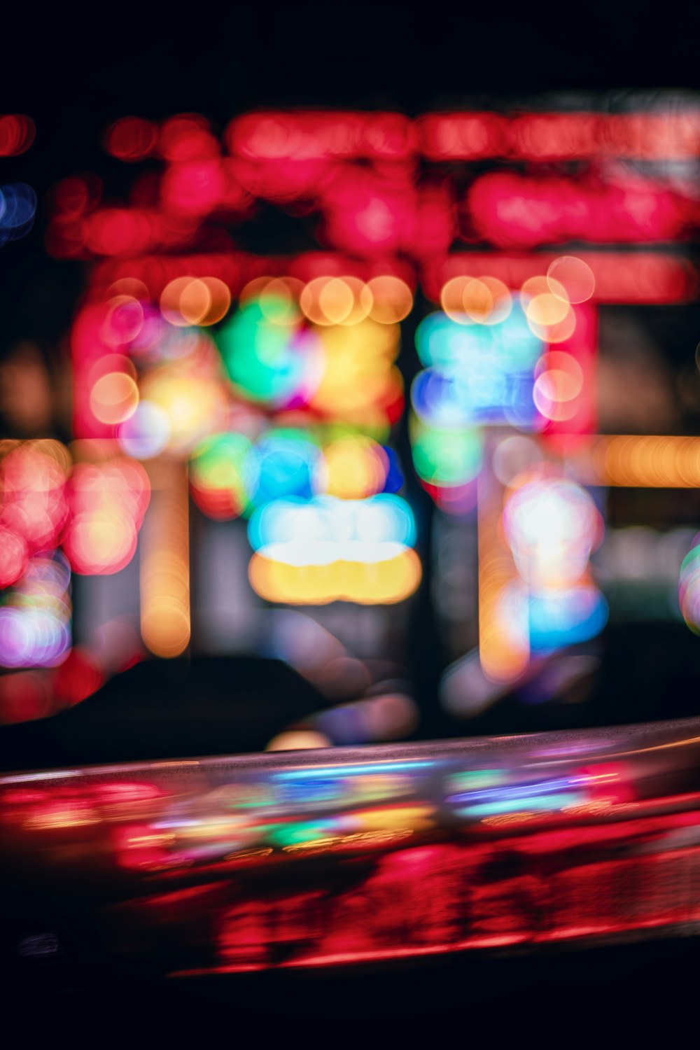 a blurry photo of a city street at night