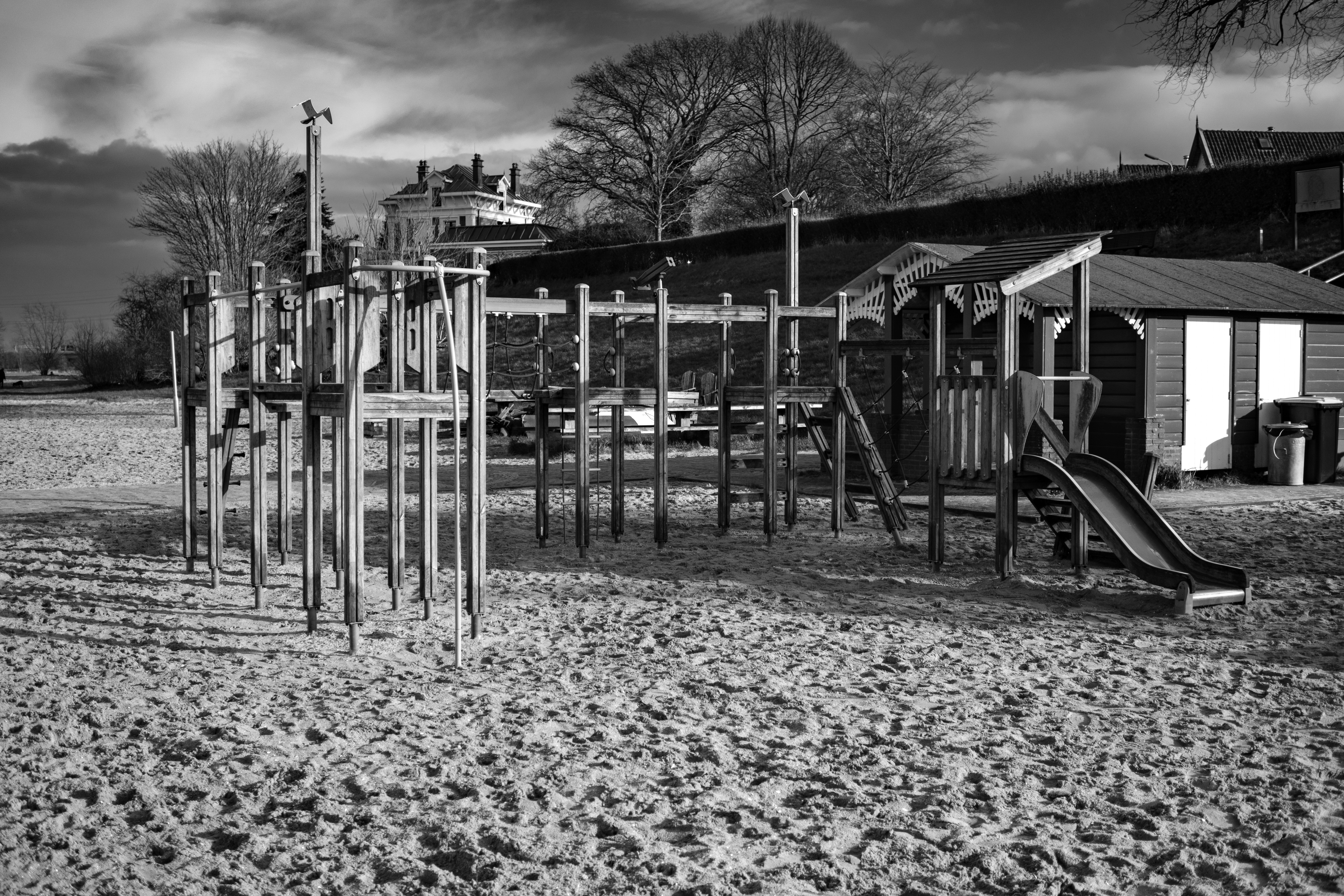 a black and white photo of a playground