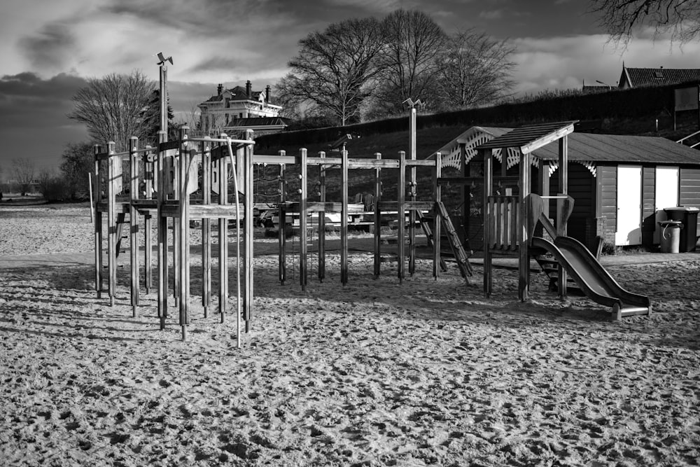 a black and white photo of a playground