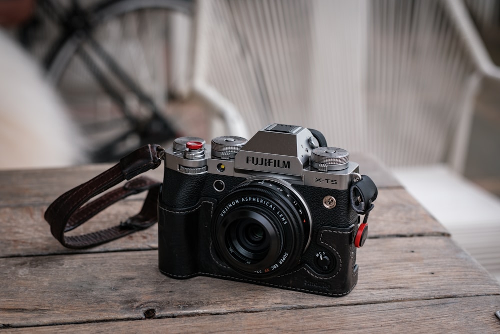 a camera sitting on top of a wooden table