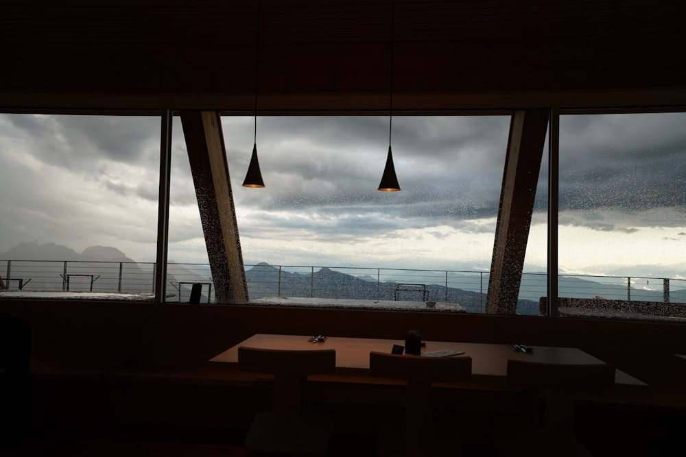 a dining room with a view of the mountains
