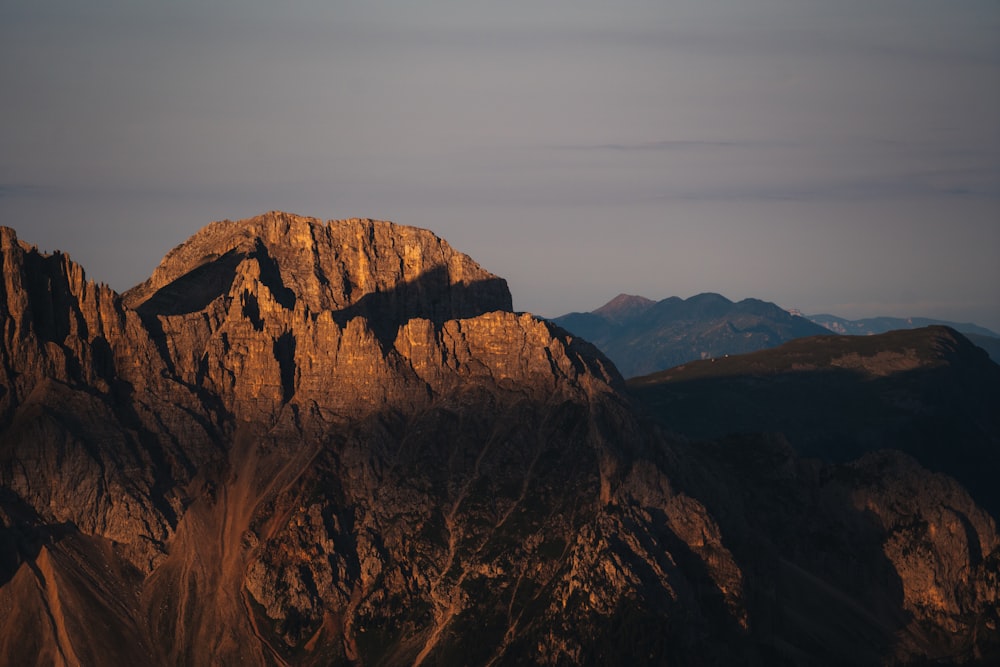 a view of a mountain range at sunset