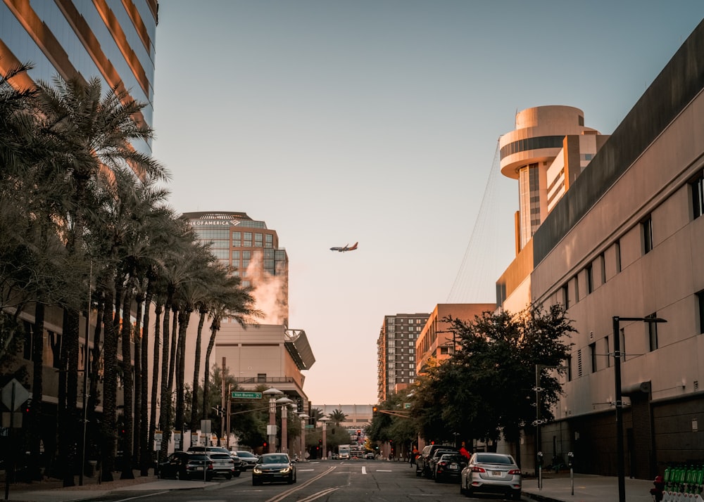 an airplane is flying over a city street
