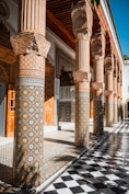 a building with a checkered floor and columns